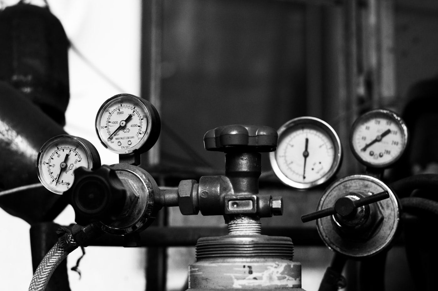 Pressure gauges and regulators on gas cylinders in a test bay