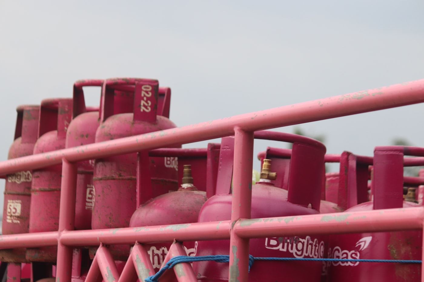 Freshly painted gas cylinders stored in racks