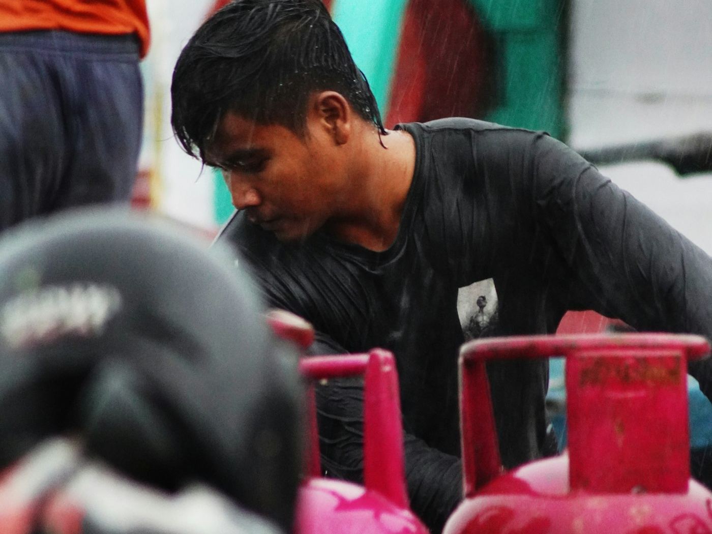 Technician working with gas cylinders on the workshop floor